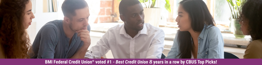 group of young adults around a table