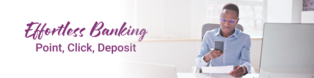 man taking picture of check with cellphone