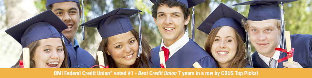 Graduates smiling with their diplomas