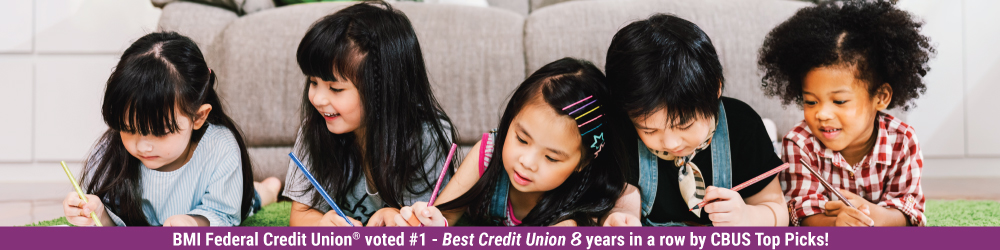 children on the floor writing in notepads