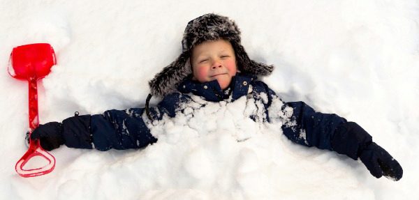 boy smiling in the snow